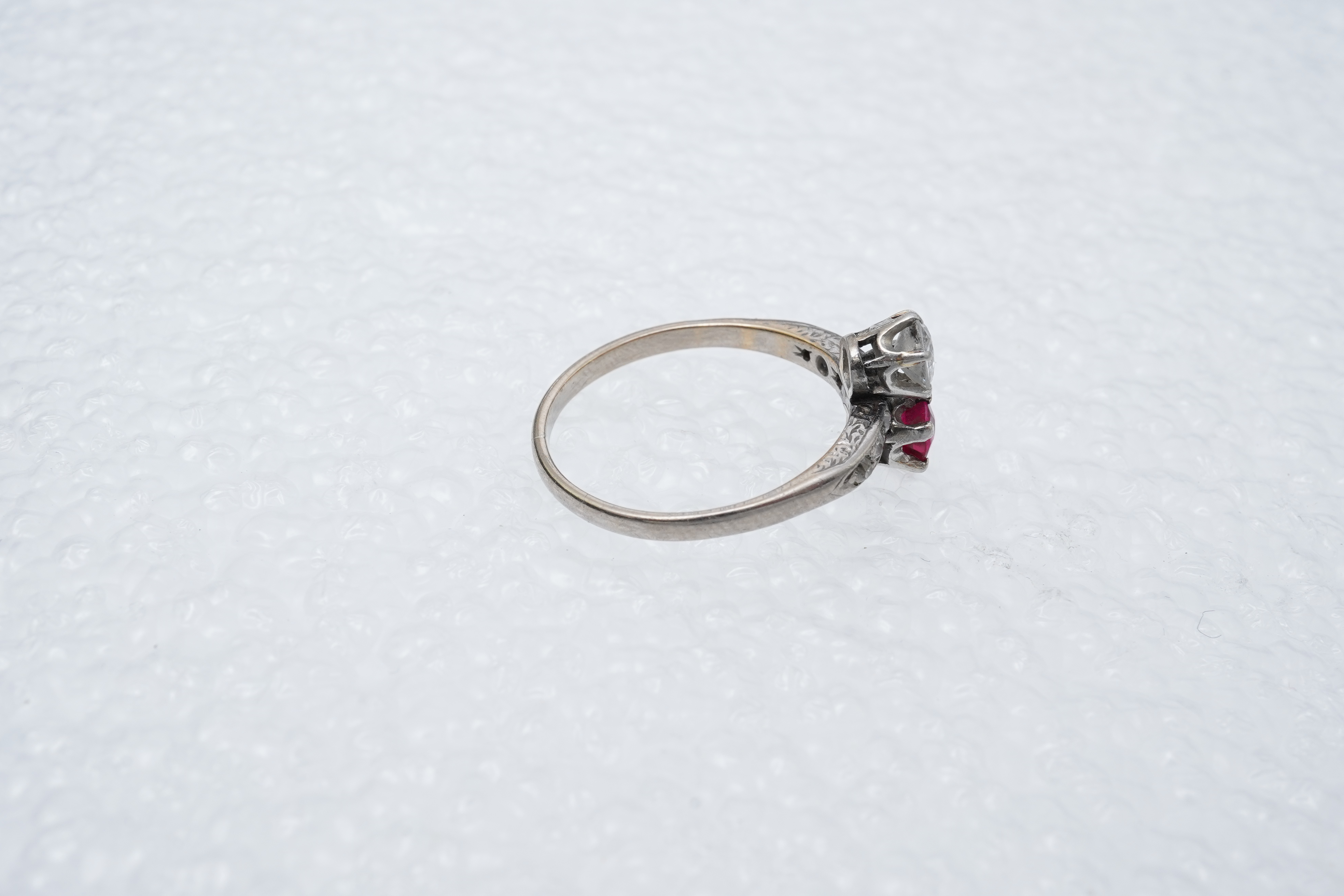 A synthetic ruby and diamond 'toi-et-moi' ring, early 20th century